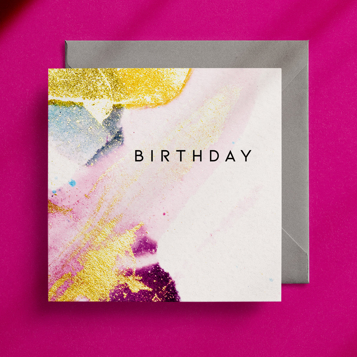 Pretty, feminine, pink, white and gold design on a square birthday card with a grey envelope