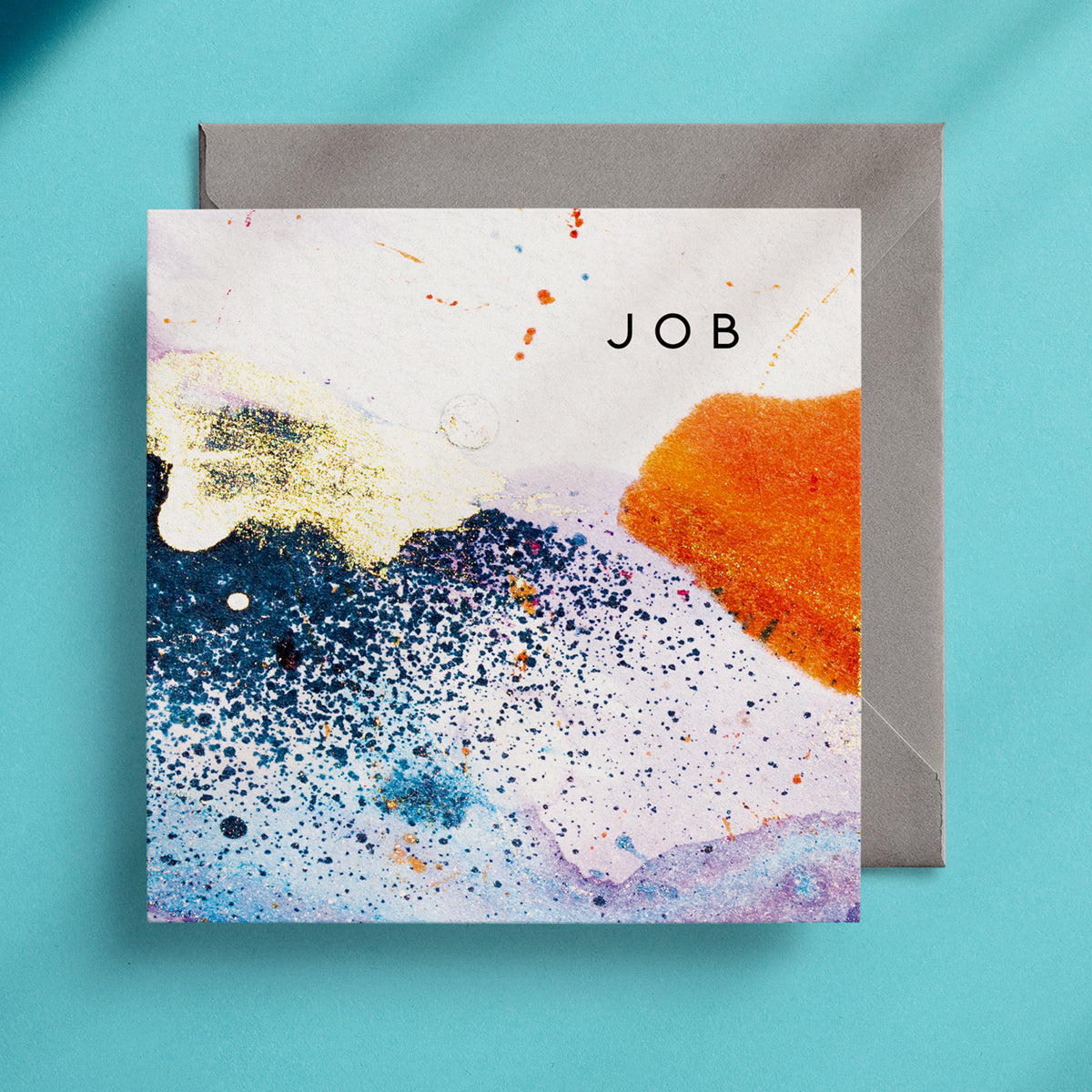 Abstract blue, gold and orange alcohol ink design on a greeting card with the word "Job" in the top right corner