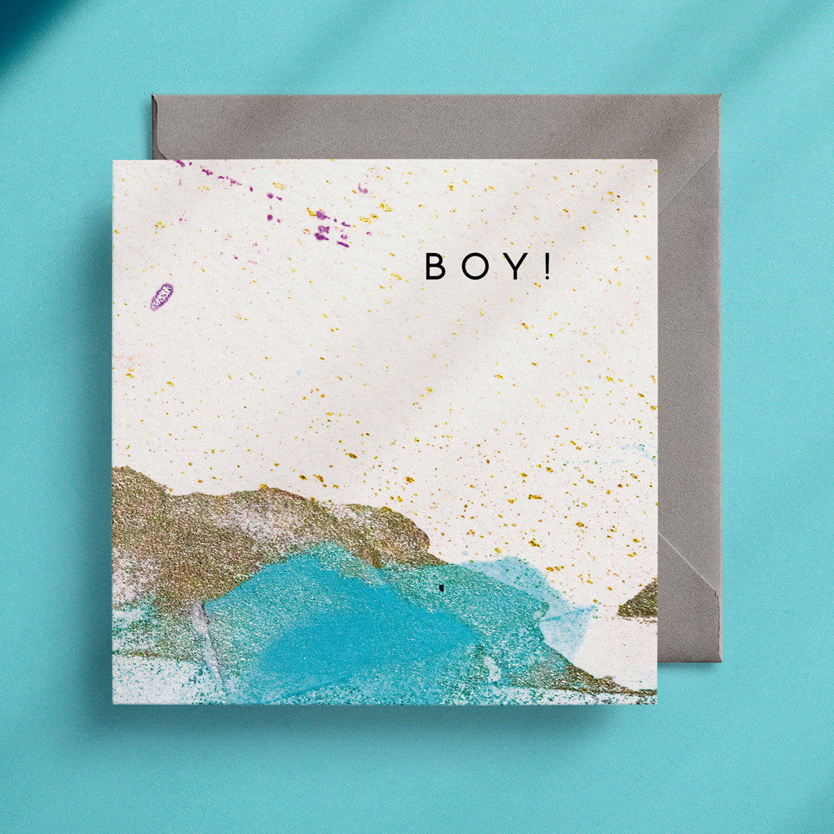 Turquoise, gold and white greeting card design with the caption "Boy!"